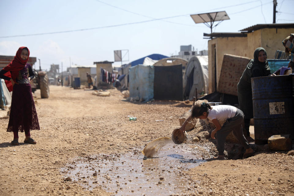 This Sunday, April 19, 2020, photo, shows a large refugee camp on the Syrian side of the border with Turkey, near the town of Atma, in Idlib province, Syria. The rapid spread of the coronavirus has raised fears about the world’s refugees and internally displaced people, many of whom live in poor or war-ravaged countries that are ill-equipped to test for the virus or contain a possible outbreak. (AP Photo/Ghaith Alsayed)
