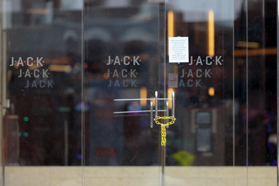 The doors to the Jack Cincinnati Casino are locked, as a sign posted on the door indicates they have closed as a result of the new coronavirus outbreak, Saturday, March 14, 2020, at the Hamilton County Board of Elections in Cincinnati, Ohio. 