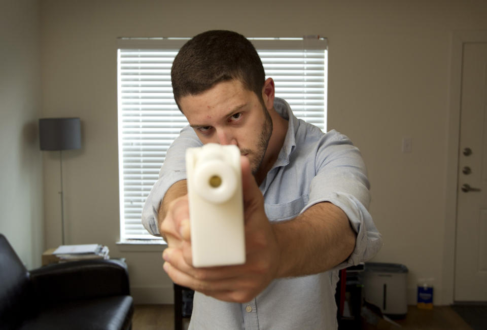 Cody Wilson shows off his first 3D-printed handgun, The Liberator, at his home in Austin, Texas, on May 10, 2013. (Photo: SIPA USA/PA Images)