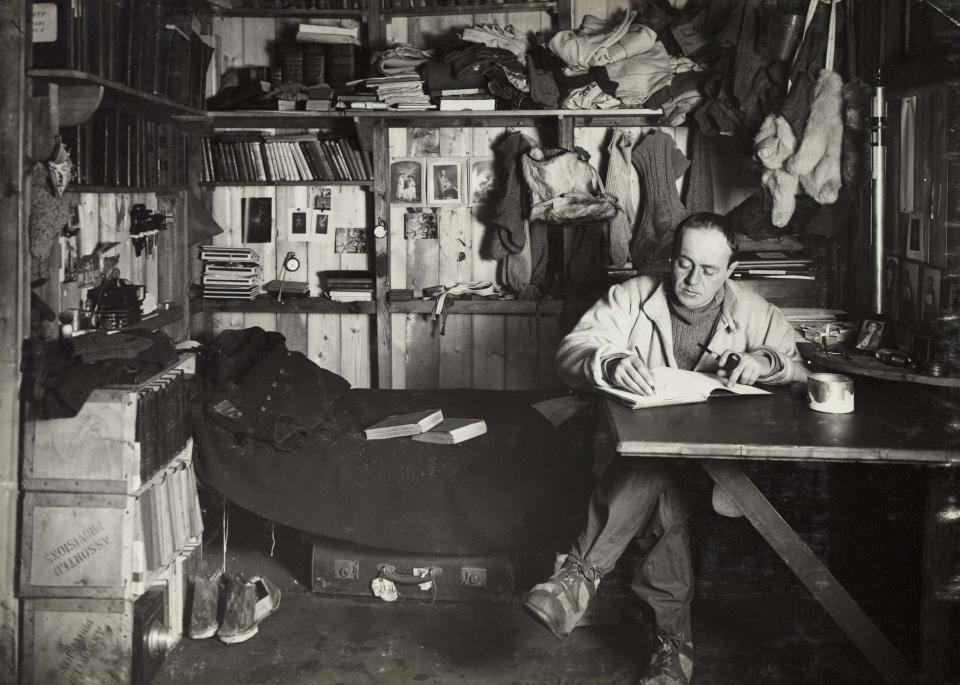 Capt Robert Falcon Scott at work in his hut, Scott’s cubicle. ©H Ponting photograph, Pennell collection, Canterbury Museum, New Zealand