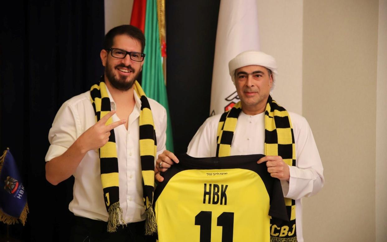 Sheikh Hamad Bin Khalifa Al Nahyan's and Beitar Jerusalem F.C. owner Moshe Hovav pose for a photo in Dubai - REUTERS