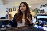 Sonya Barlow, left, CEO of Like Minded Females Network, talks during a meeting at White Mulberries, a coffee shop in London, Thursday, Sep. 2, 2021. Many young workers around the world have entered the workforce and begun their careers during the pandemic working entirely remotely. Like Minded Females Network is a social enterprise that helps young women set up businesses and other ventures, without the use of a fixed office space. (AP Photo/Urooba Jamal)