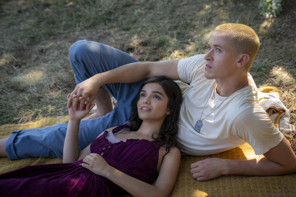 This image released by Lionsgate shows Rachel Zegler as Lucy Gray Baird, left, and Tom Blyth as Coriolanus Snow in a scene from "The Hunger Games: The Ballad of Songbirds and Snakes." (Murray Close/Lionsgate via AP)