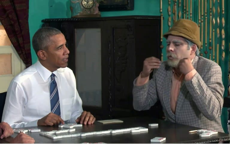 TV grab released by Cubadebate shows US President Barack Obama (L) playing dominoes with Cuban TV character Don Panfilo during a Cuban TV show in Havana