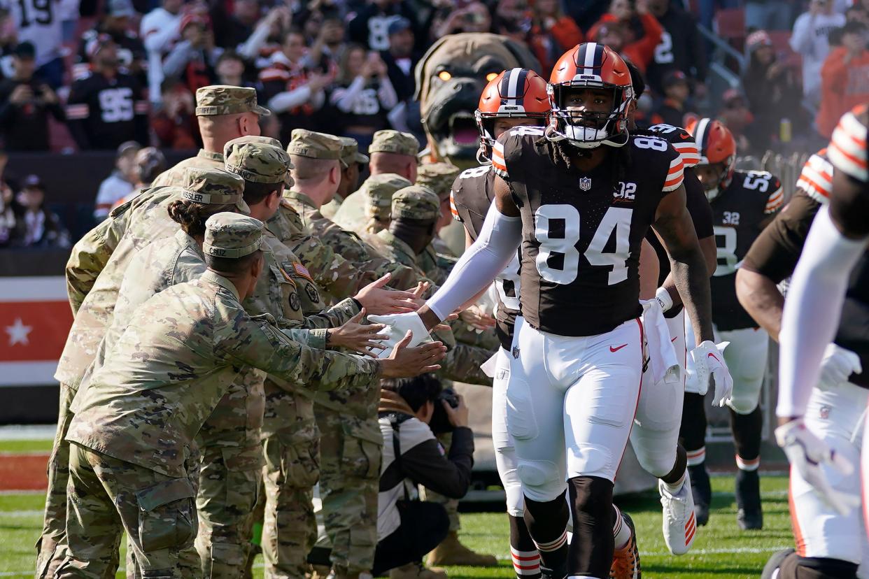 Cleveland Browns tight end Jordan Akins (84) is greeted before a game against the Arizona Cardinals on Nov. 5 in Cleveland.