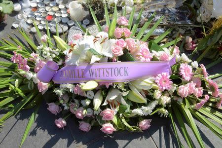 Flowers placed by Michael Kenneth Wittstock, the father of Monaco's Princess Charlene, are seen at a makeshift memorial to the victims of the truck attack are seen along the Promenade des Anglaisin Nice, France, July 21, 2016. REUTERS/Jean-Pierre Amet