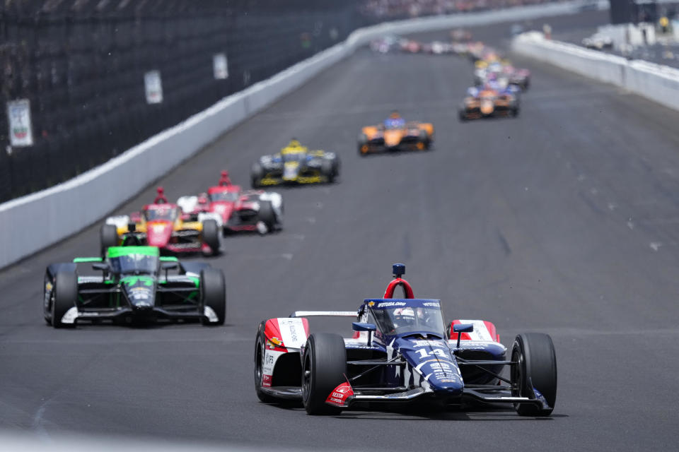 Santino Ferrucci leads the field into the first turn during the Indianapolis 500 auto race at Indianapolis Motor Speedway in Indianapolis, Sunday, May 28, 2023. (AP Photo/AJ Mast)