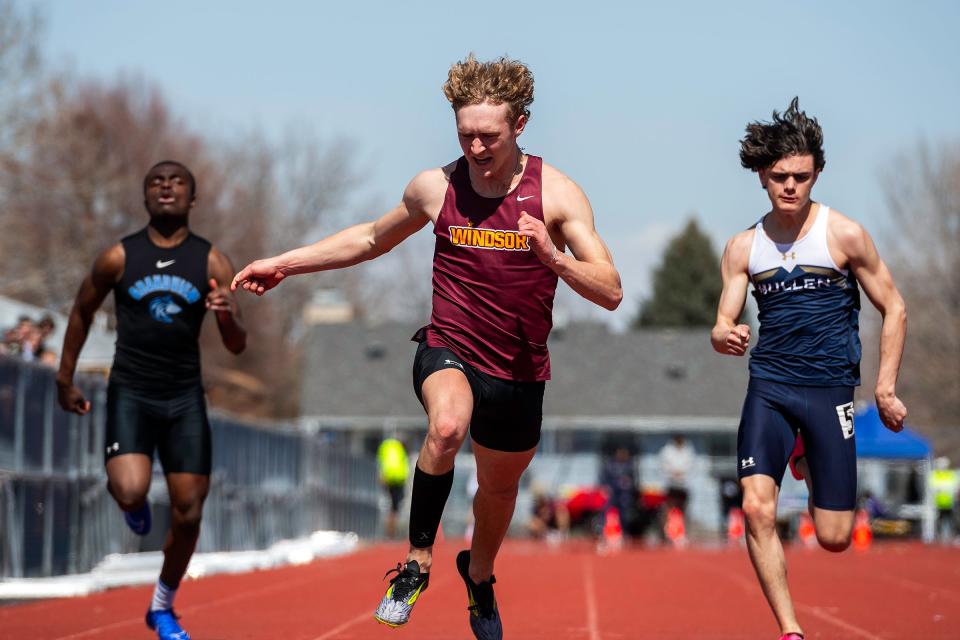 Windsor's Mikey Munn reacts as he crosses the finish line for a 100-meter race during the Runners Roost Invite on March 22 at French Field in Fort Collins.