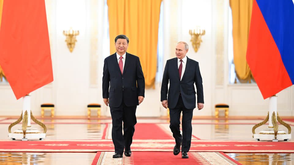 Russian President Vladimir Putin welcomes Chinese leader Xi Jinping for a state visit on March 21, 2023. - Xie Huanchi/Xinhua/Getty Images