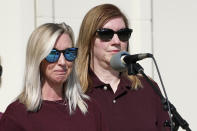 Hollie Skaggs, left, fights back tears as she and Sara Wiles, right, speak during a prayer vigil at the Collierville Town Hall, Friday, Sept. 24, 2021, in Collierville, Tenn. Both Skaggs and Wiles were shopping in a Kroger grocery store Thursday when a gunman attacked people, killing one and injuring several, before he was found dead of an apparent self-inflicted gunshot wound. (AP Photo/Mark Humphrey)