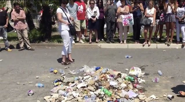 A pile of rubbish has been built in the spot where the Nice attacker died. Source: Michael Birnbaum Twitter