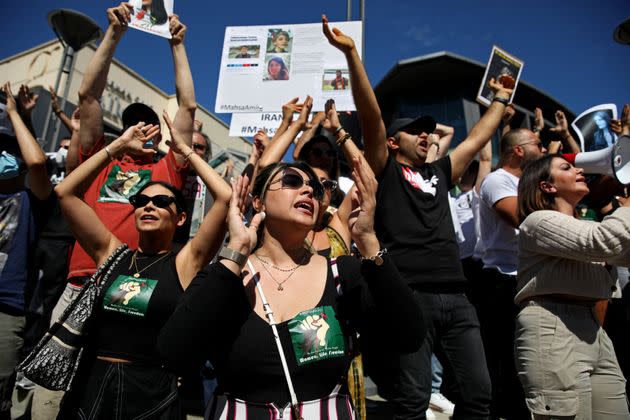 Hundreds of people gather in front of the Sherman Oaks Galleria in memory of Mahsa Amini, 22, who died in police custody after being arrested for violating Iran's hijab rules, on Sunday in Los Angeles. (Photo: Gary Coronado / Los Angeles Times via Getty Images)