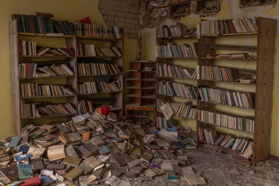 This photograph taken on Nov. 4, 2023, shows a pile of books inside the damaged House of Culture in Posad-Pokrovske, a village in partially-occupied Kherson Oblast. (Roman Pilipey/AFP via Getty Images)