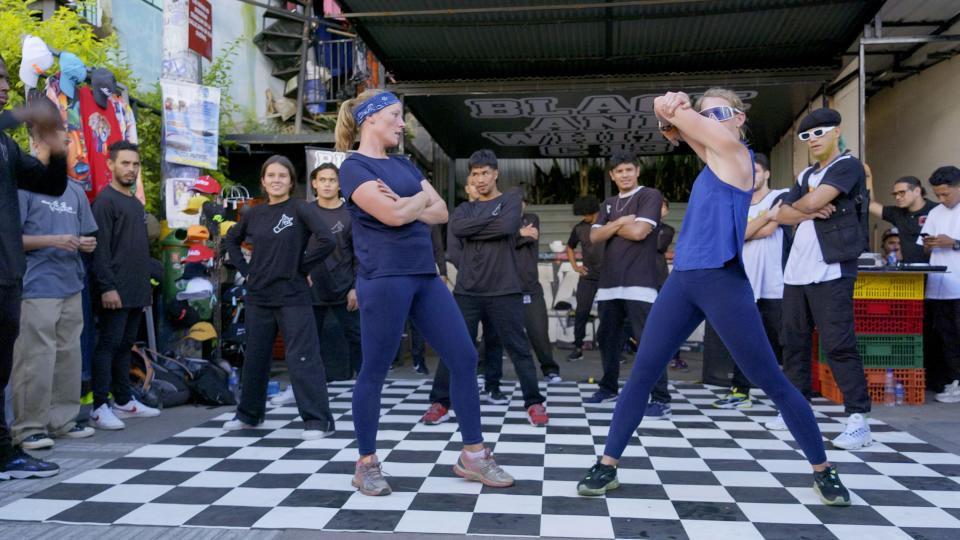 Sunny Pulver and Bizzy Smith compete in the breakdance challenge on the fourth episode of "The Amazing Race." The Wisconsin firefighters advanced after making a remarkable comeback.