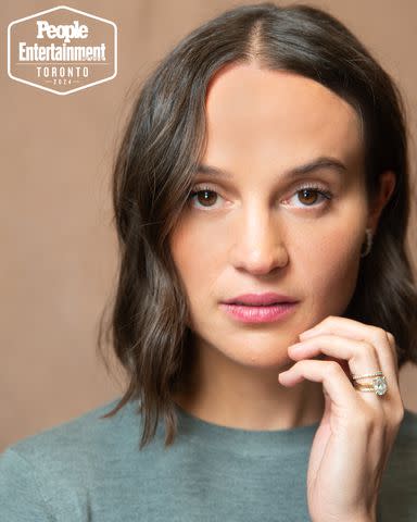 <p>Ben Trivett/Shutterstock</p> Alicia Vikander (The Assessment) photographed in the PEOPLE, EW and Shutterstock Toronto International Film Festival 2024 Portrait Studio on September 8, 2024 in Toronto, Ontario, Canada.