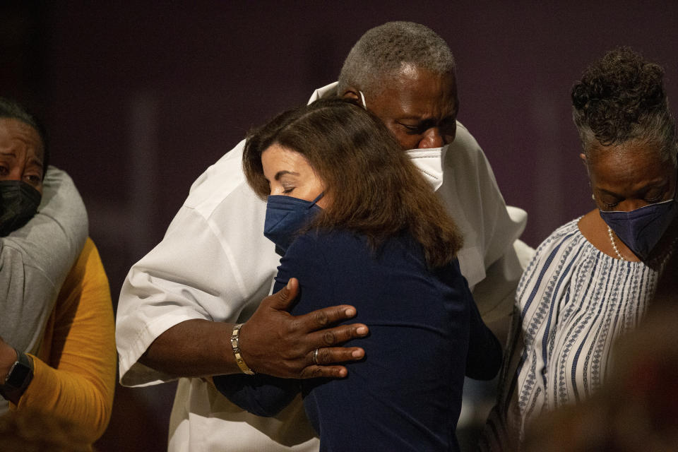 New York Gov. Kathy Hochul hugs Charles Everhart Sr. as service ends at True Bethel Baptist Church on Sunday, May 15, 2022, in Buffalo, N.Y. Everhart’s grandson, Zaire Goodman, was shot in the neck and survived during a shooting at a Buffalo supermarket on May 14. Goodman was released from the hospital last night. “I’m just grateful that God saved his life,” said Everhart. - Credit: Joshua Bessex/AP Photo