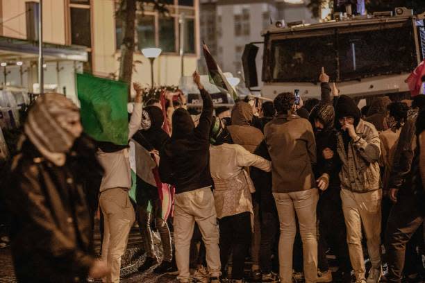 Protesters demonstrate in front of the Israeli Consulate after an explosion at a hospital in Gaza killed hundreds on 17 October 2023 (Middle East Images/AFP via Getty)