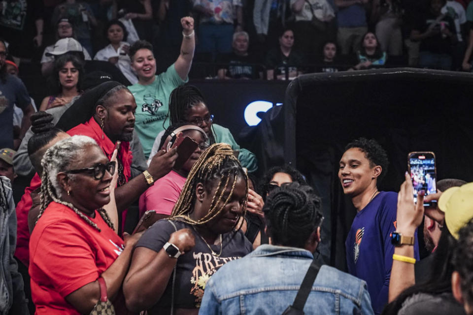 Phoenix Mercury center Brittney Griner, right, mingles with fans for photos after a WNBA basketball game against the New York Liberty, Sunday, June 18, 2023, in New York. (AP Photo/Bebeto Matthews)