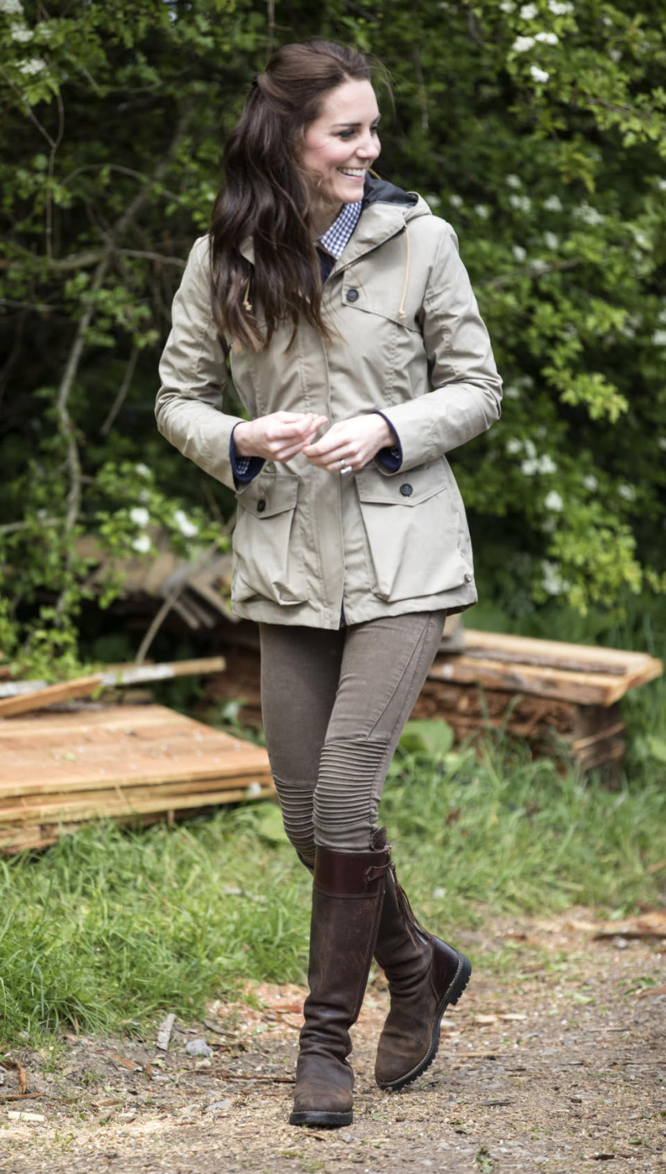 <p>The Duchess dressed down to visit a city farm in Gloucestershire. Wearing a £350 wax parka by Troy London, Kate donned brown biker jeans from Zara, a navy J Crew sweater and gingham shirt from Gap. She finished the neutral ensemble with tasselled Penelope Chilvers boots that she has been wearing for a whopping 13 years. </p><p><i>[Photo: PA]</i></p>