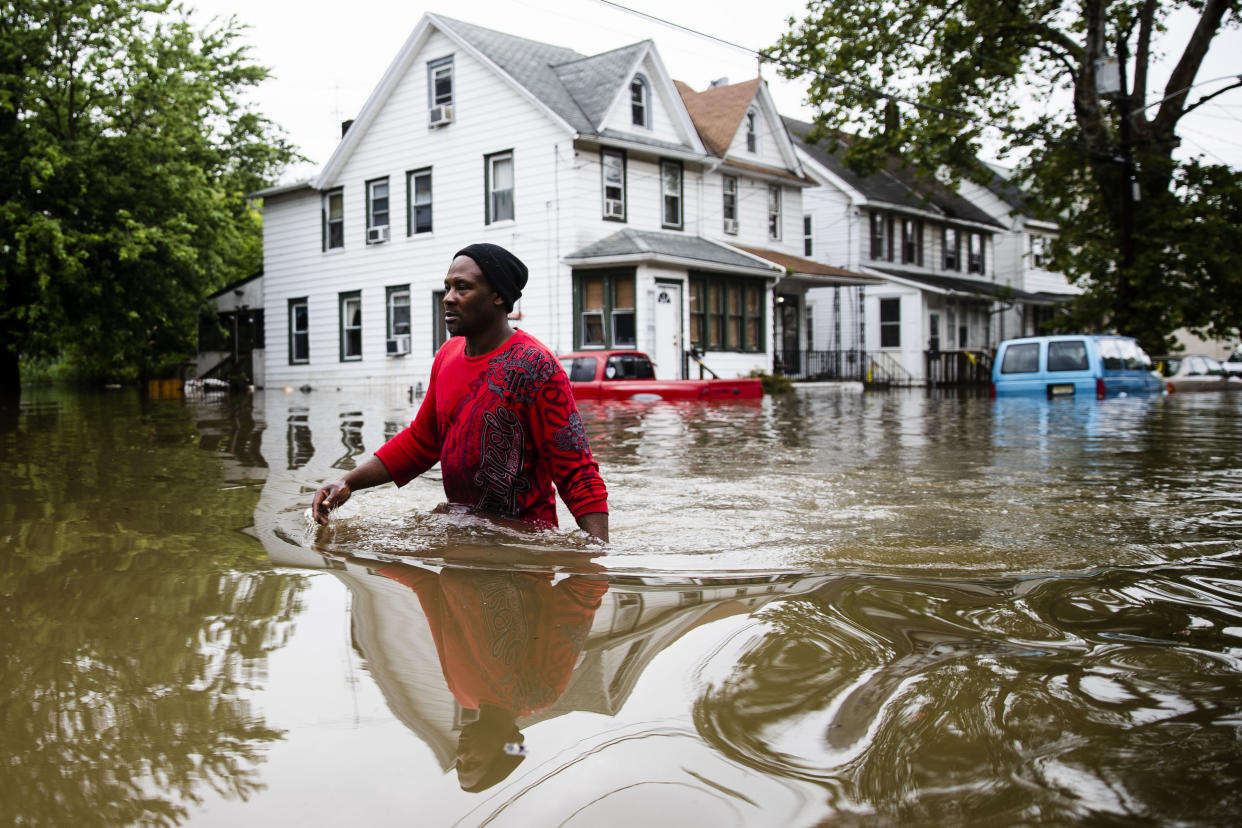 Chris Smith makes his way through floodwaters to the Macedonia Baptist Church in Westville, N.J., Thursday, June 20, 2019. Severe storms containing heavy rains and strong winds spurred flooding across southern New Jersey, disrupting travel and damaging some property. (Photo: Matt Rourke/AP)