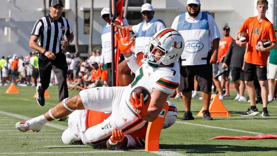 Miami Hurricanes wide receiver Xavier Restrepo (7) scores as Miami Hurricanes Savion Riley (19) attempts the stop in the first half during the Canes spring football game at the University of Miami’s Cobb Stadium in Coral Gables, Florida on Saturday, April 13, 2024.