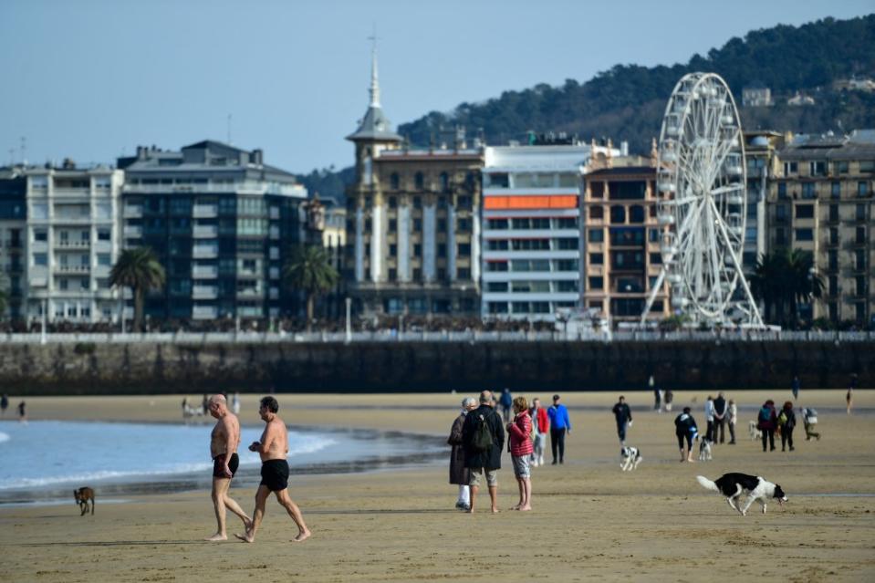 “La Concha Beach is an iconic spot right in the city, with a huge sandy shore and clear, blue waters,” Tripadvisor explained. AFP via Getty Images