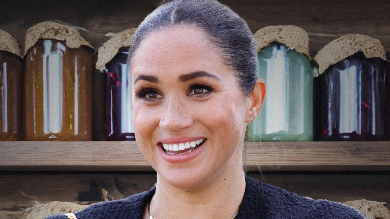 a person smiling with a gold chain