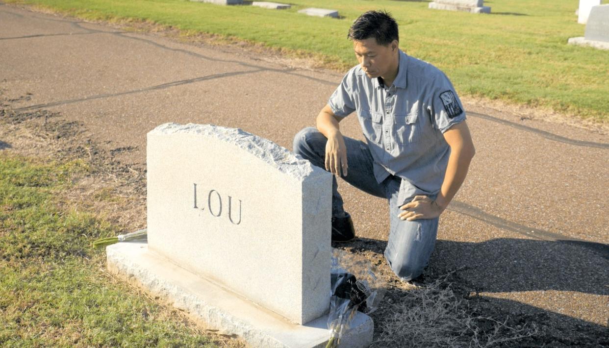Baldwin Chiu visiting the grave of his grandfather and great-grandfather in a scene from "Far East Deep South"