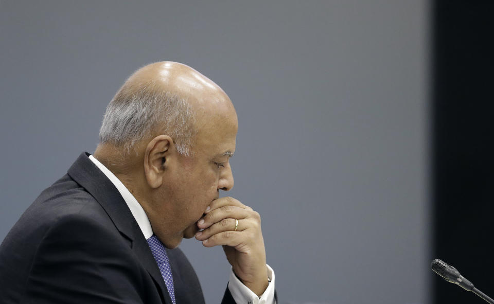 Public Enterprises Minister Pravin Gordhan appears at the judicial commission of inquiry into state capture in Johannesburg, South Africa, Monday, Nov. 19, 2018. Gordhan is expected to reveal details surrounding former president Jacob Zuma's trillion-rand nuclear procurement campaign as well as other corruption practices. (AP Photo/Themba Hadebe)