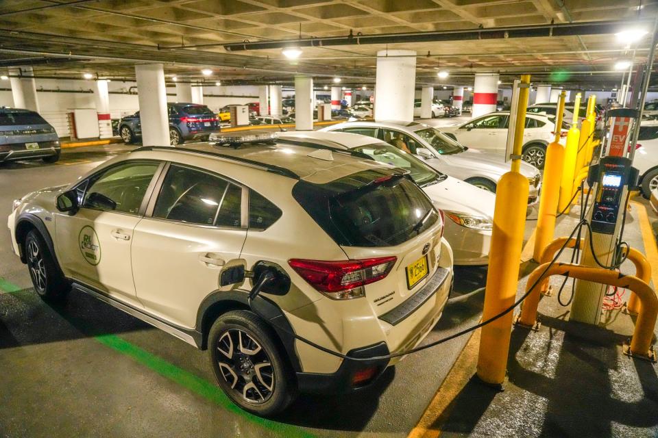 One of the Department of Transportation's Subaru Crosstreks gets a charge in the DOT garage. The $35,000 plug-in hybrids get up to 90 miles per gallon and have a range of nearly 500 miles.