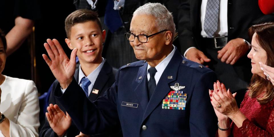 Tuskegee airman Charles McGee, 100, and his great grandson Iain Lanphier react as President Donald Trump delivers his State of the Union address to a joint session of Congress on Capitol Hill in Washington, Tuesday, Feb. 4, 2020. (AP Photo/Patrick Semansky)