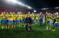 Sweden coach Hakan Ericson celebrates winning the final with the trophy Action Images via Reuters / Lee Smith