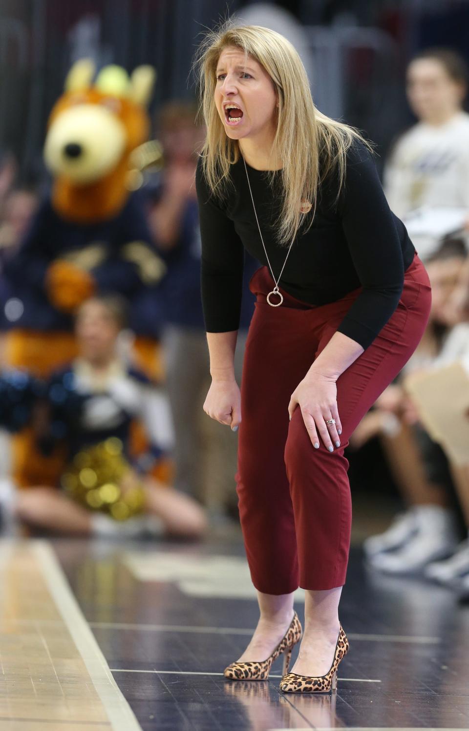 University of Akron coach Melissa Jackson watches on the sideline as the Zips take on Buffalo in a Mid American Conference semifinal Friday at Rocket Mortgage FieldHouse. The Zips lost 82-43. [Phil Masturzo/Beacon Journal]