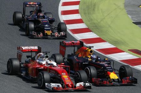 Formula One - Spanish Grand Prix - Barcelona-Catalunya racetrack, Montmelo, Spain - 15/5/16 Red Bull F1 driver Daniel Ricciardo (R) of Australian tries to overtake Ferrari F1 driver Sebastian Vettel of Germany during Spanish Grand Prix. REUTERS/Albert Gea