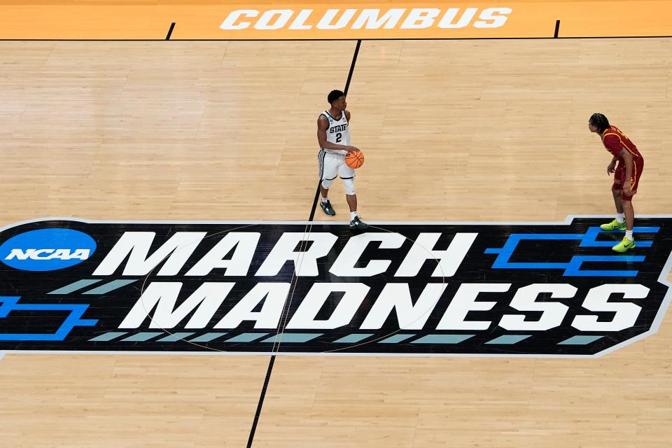 Mar 17, 2023; Columbus, Ohio, USA;  Michigan State Spartans guard Tyson Walker (2) brings the ball up court toward USC Trojans guard Boogie Ellis (5) during the first round of the NCAA men’s basketball tournament at Nationwide Arena. Mandatory Credit: Adam Cairns-The Columbus Dispatch