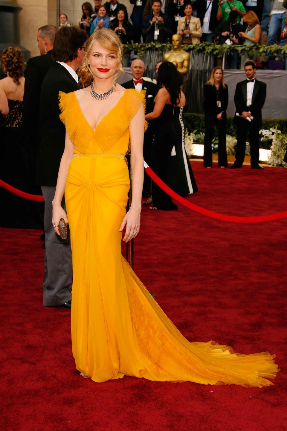 Red carpet, Carpet, Clothing, Dress, Gown, Flooring, Premiere, Yellow, Fashion, Shoulder, 