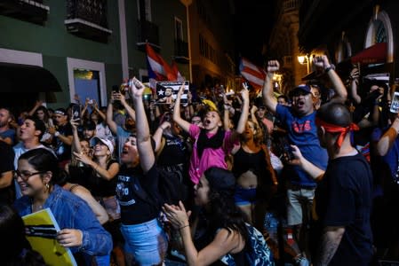 Demonstrators celebrate after the resignation of Puerto Rico Governor Rossello in San Juan