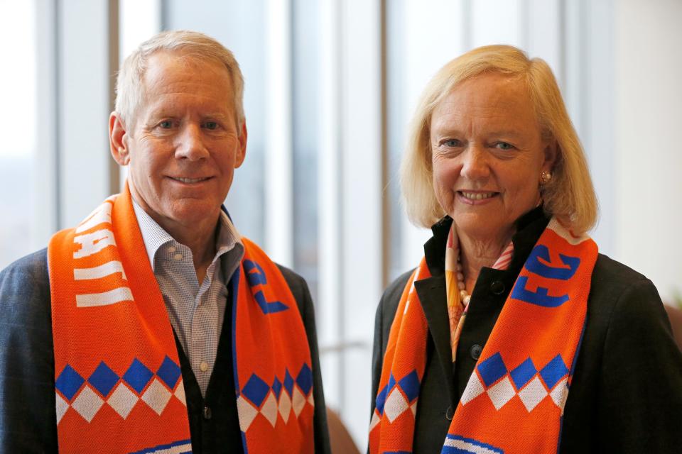 FC Cincinnati controlling owner Carl H. Lindner III poses with new managing owner Meg Whitman after a press conference at Great American Tower in downtown Cincinnati on Monday, Dec. 9, 2019. FC Cincinnati hosted a press conference to introduce Meg Whitman, who joins the team as a managing owner. 