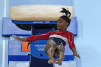 FILE - In this July 27, 2021 file photo, Simone Biles, of the United States, performs on the vault during the artistic gymnastics women's final at the 2020 Summer Olympics, in Tokyo. Biles and Naomi Osaka are prominent young Black women under the pressure of a global Olympic spotlight that few human beings ever face. But being a young Black woman -- which, in American life, comes with its own built-in pressure to perform -- entails much more than meets the eye. (AP Photo/Natacha Pisarenko, File)