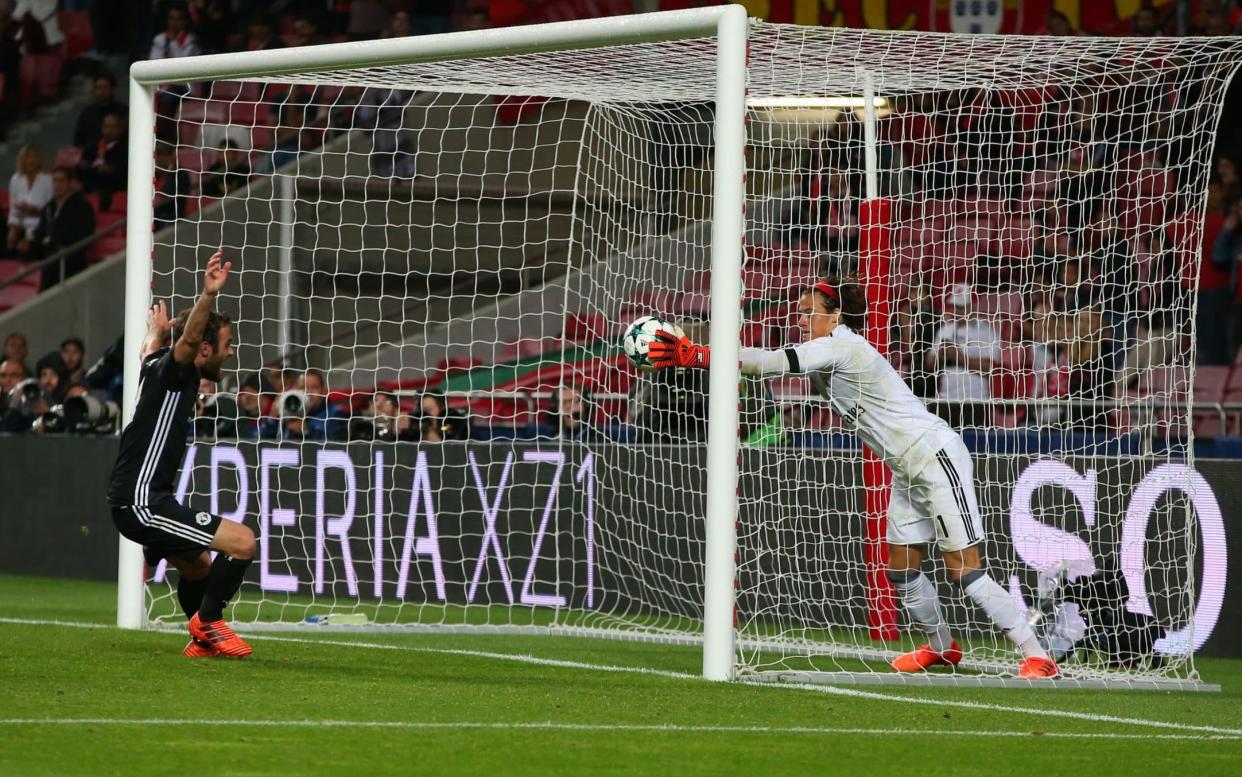 Mile Svilar, the youngest goalkeeper in Champions League history, carries the ball over the line from Manchester United Marcus Rashford's free-kick to score a decisive own goal - Getty Images Europe