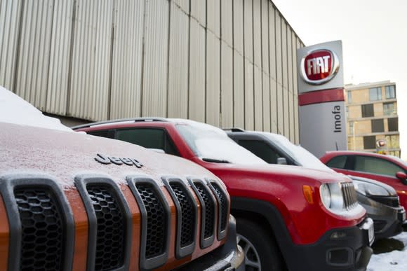 Jeeps lined up outside a Fiat Chrysler building.