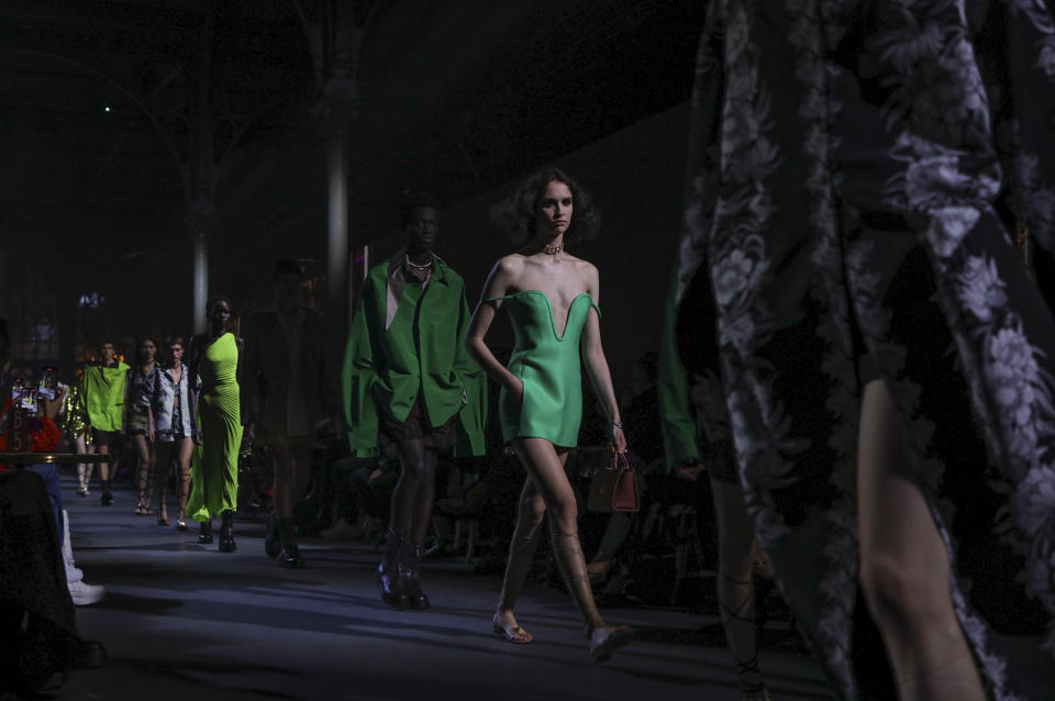 Models wear creations for the Valentino Spring-Summer 2022 ready-to-wear fashion show presented in Paris, Friday, Oct. 1, 2021. (Photo by Vianney Le Caer/Invision/AP)