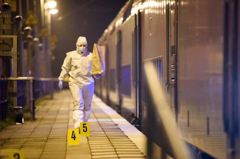 Forensic staff of the police secures evidence on the platform of the train station in Brokstedt, northern Germany, on January 25, 2023, after two people were killed and several others wounded in a knife attack on a regional train between the cities of Hamburg and Kiel. - Police announced that the alleged assailant had been captured. The suspect was taken into custody at the railway station in the town of Brokstedt. It was not immediately clear how many people had been injured or how serious their condition was. Media reports cited around five wounded. (Photo by Gregor Fischer / AFP) (Photo by GREGOR FISCHER/AFP via Getty Images)