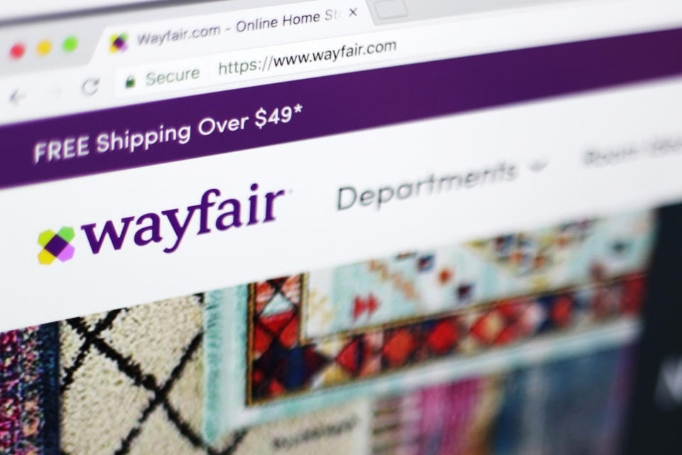 FILE - This April 17, 2018 file photo shows the Wayfair website on a computer in New York. On Friday, July 17, 2020, The Associated Press reported on stories circulating online incorrectly asserting Niraj Shah, chief executive officer of the furniture company Wayfair, has resigned amid child sex trafficking allegations against the company. Shah has not stepped down, according to a Wayfair spokesperson, and claims the company is involved in child trafficking are part of an unfounded conspiracy theory. Other bogus claims spreading online include a parody Wayfair advertisement that’s been mistaken as real, and a photo of longtime Jeffrey Epstein associate Ghislaine Maxwell with a luxury watch businessman who’s been falsely identified as a Wayfair employee. (AP Photo/Jenny Kane, File)