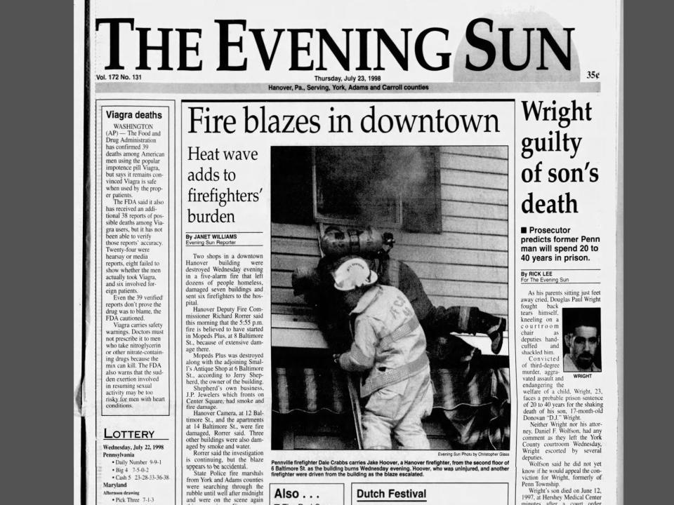 A clipping of the front page of the July 23, 1998 edition of the Evening Sun, featuring a large fire in downtown Hanover.