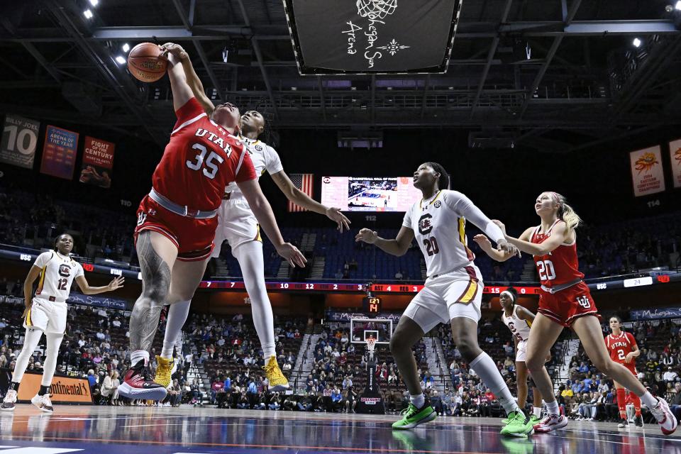 South Carolina forward Ashlyn Watkins, second from front left, blocks a shot by Utah forward Alissa Pili (35) in the first half of an NCAA college basketball game, Sunday, Dec. 10, 2023, in Uncasville, Conn. | Jessica Hill, Associated Press