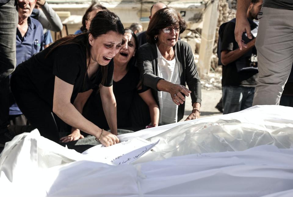 Relatives mourn during an Oct. 20, 2023, funeral ceremony for Palestinians who were killed in Gaza’s Church of Saint Porphyrius in Gaza City. <a href="https://www.gettyimages.com/detail/news-photo/relatives-mourn-during-the-funeral-ceremony-for-news-photo/1735021871" rel="nofollow noopener" target="_blank" data-ylk="slk:Photo by Ali Jadallah/Anadolu via Getty Images;elm:context_link;itc:0;sec:content-canvas" class="link ">Photo by Ali Jadallah/Anadolu via Getty Images</a>