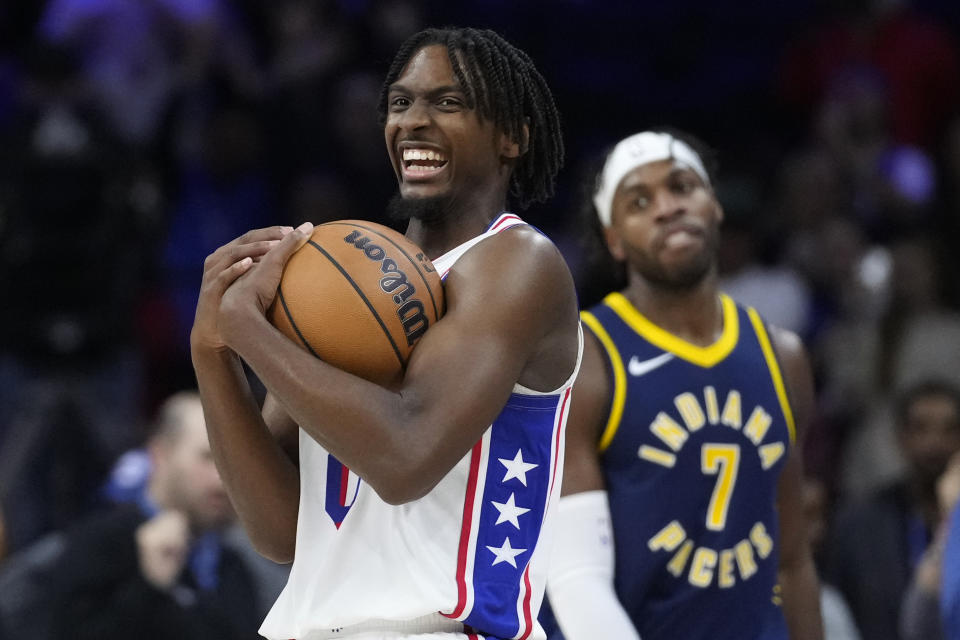 Philadelphia 76ers' Tyrese Maxey reacts past Indiana Pacers' Buddy Hield in the final minute of an NBA basketball game, Sunday, Nov. 12, 2023, in Philadelphia. (AP Photo/Matt Slocum)