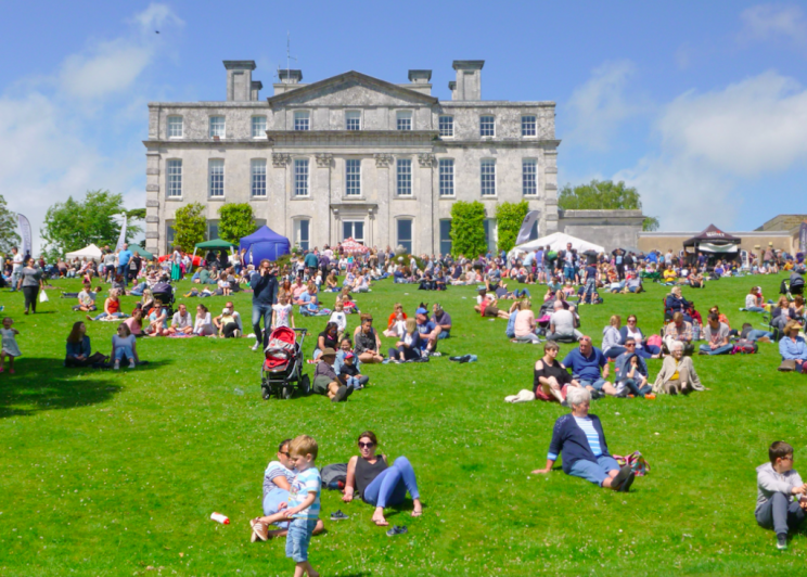 People enjoy the sun at Kingston Maurward House in Dorset on Sunday (Picture: Rex)