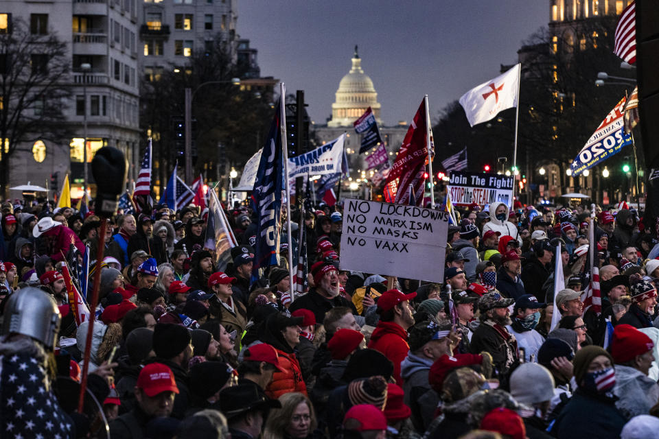 Supporters of President Donald Trump gather in the rain in Freedom Plaza in DC. Source: Getty